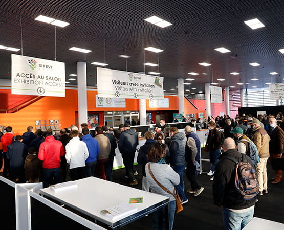 Visitors waiting at the exhibition reception desk
