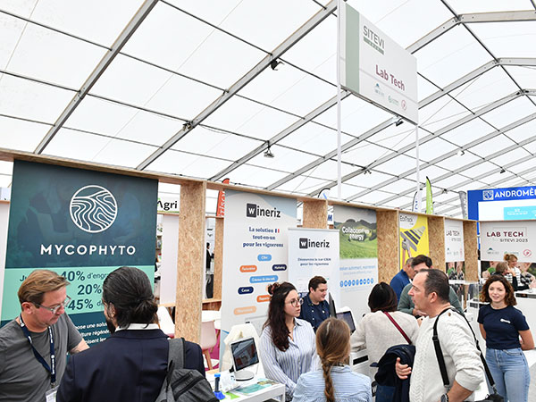 Visitors in front of the Mycophyto stand in the Lab Tech